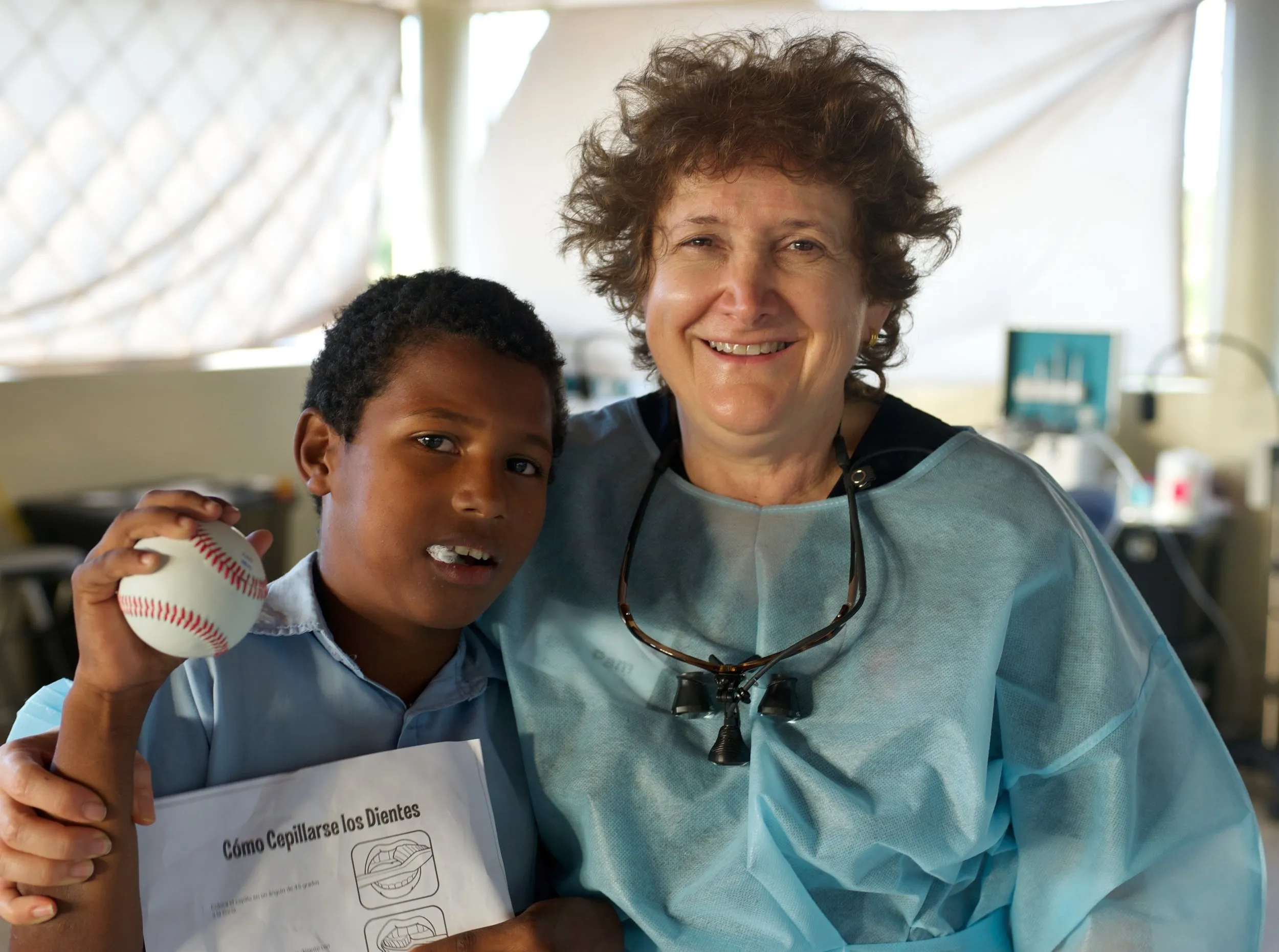 A young patient and his dentist — and his baseball