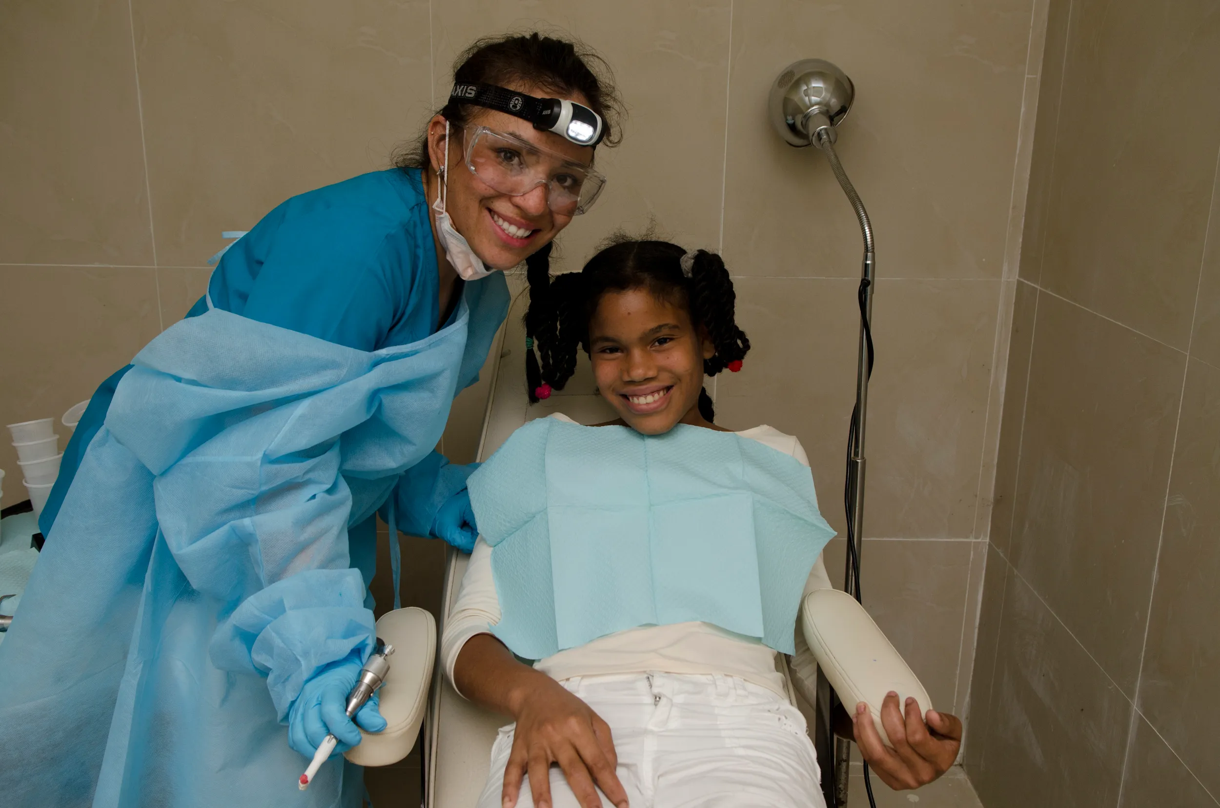 A dentist with her young patient