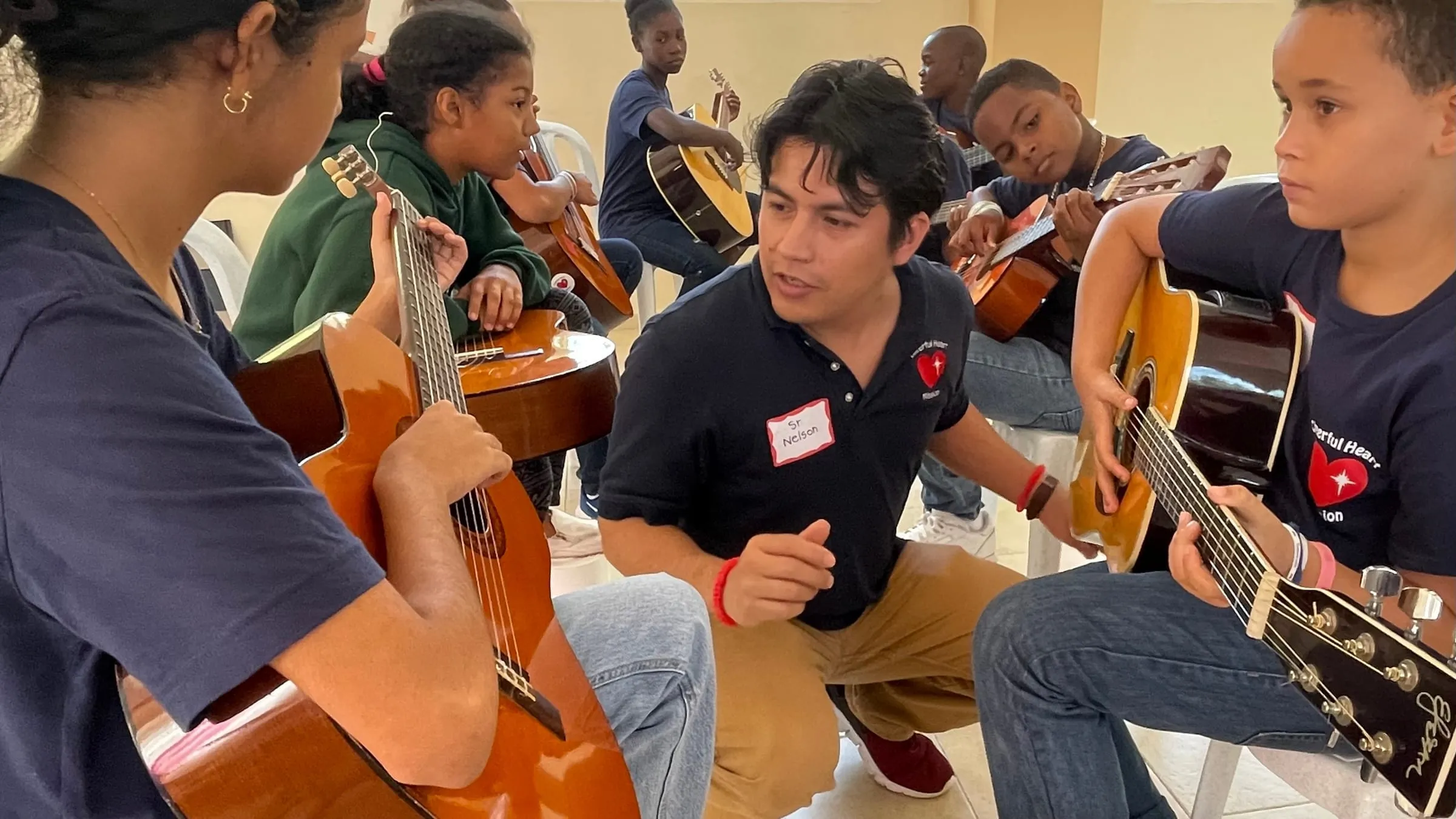 A guitar lesson with students