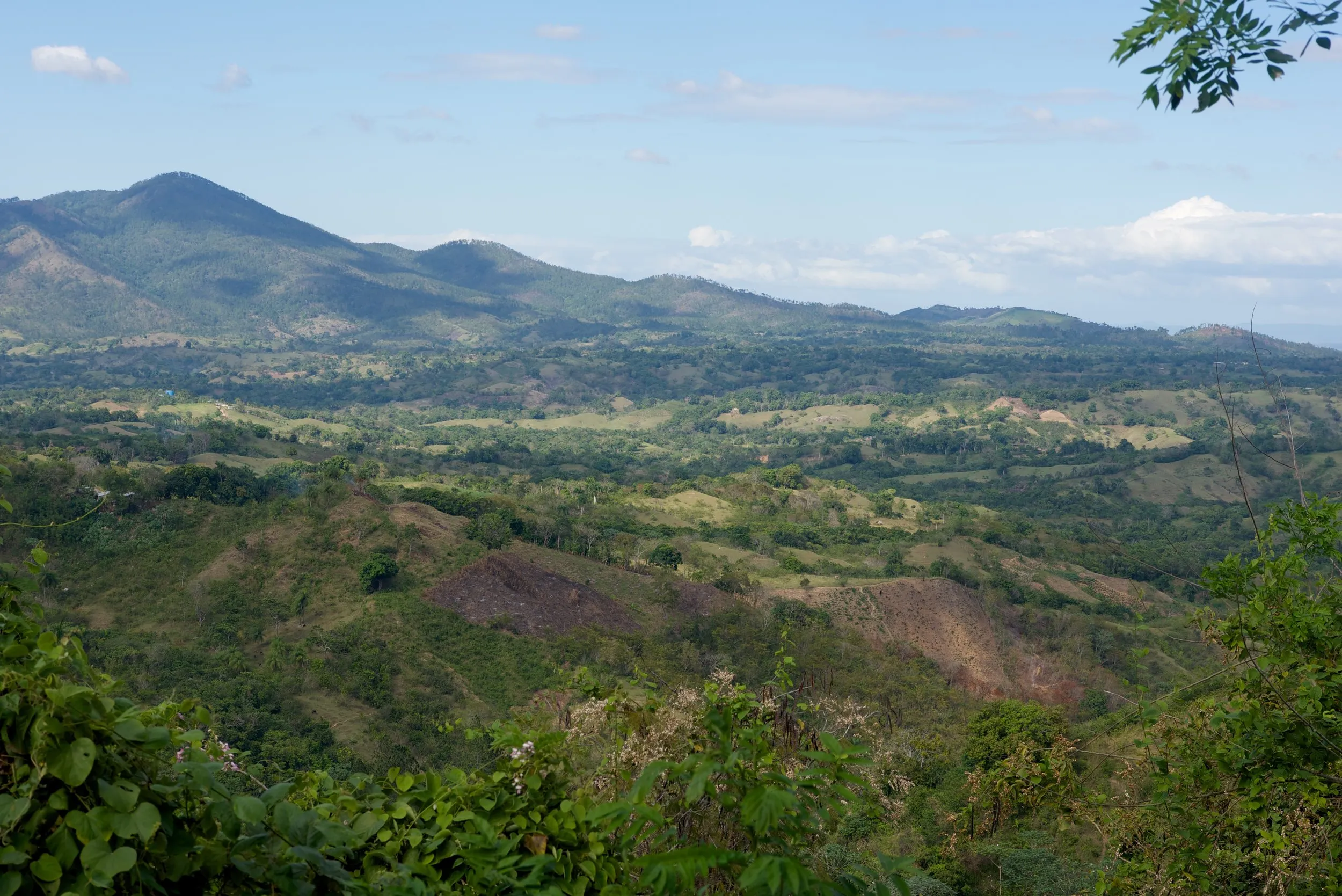 A green mountain valley in the DR–Haiti border region of Hispaniola