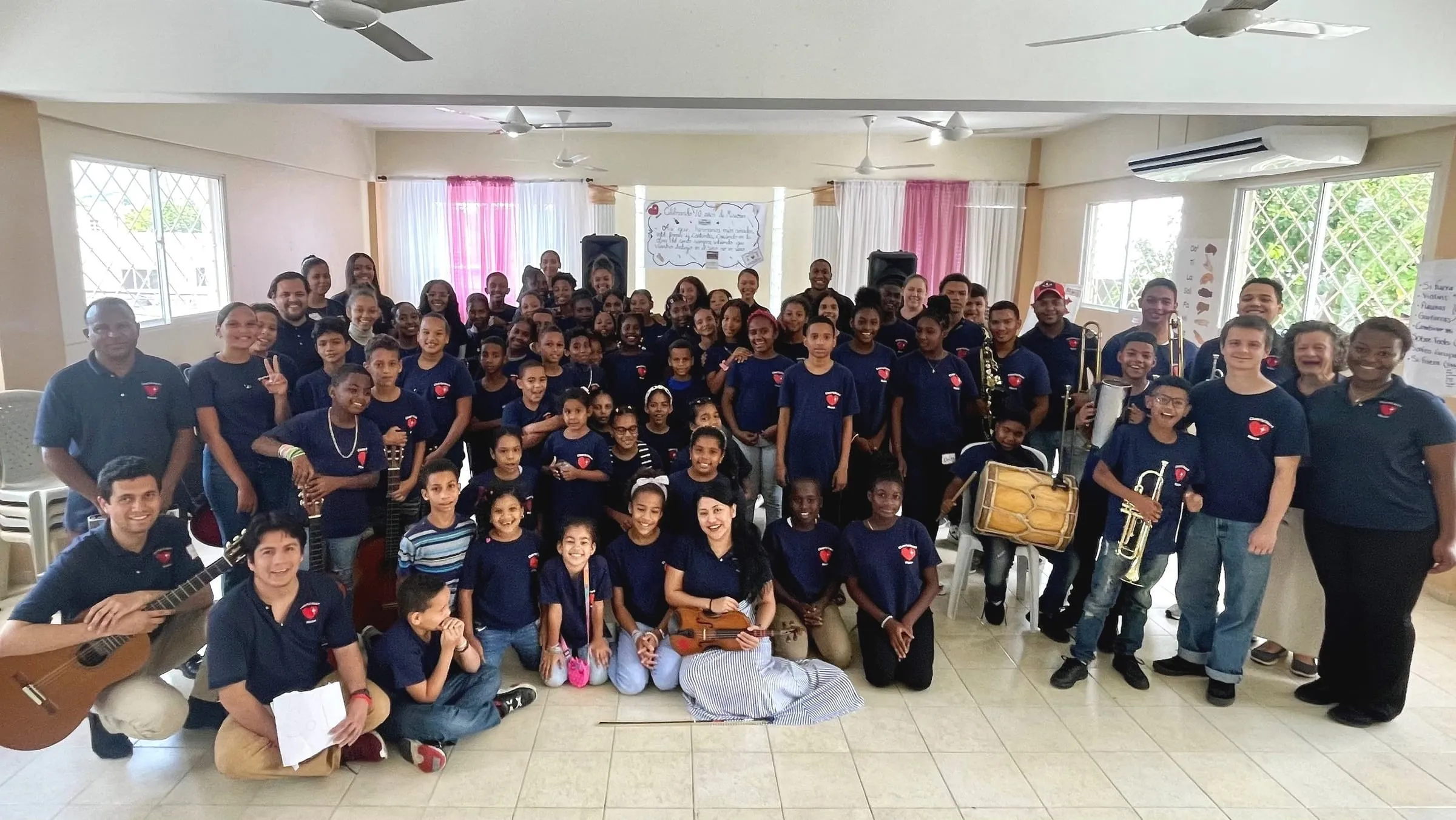 Students and instructors of the Cheerful Heart School of Music gathered for a group photo