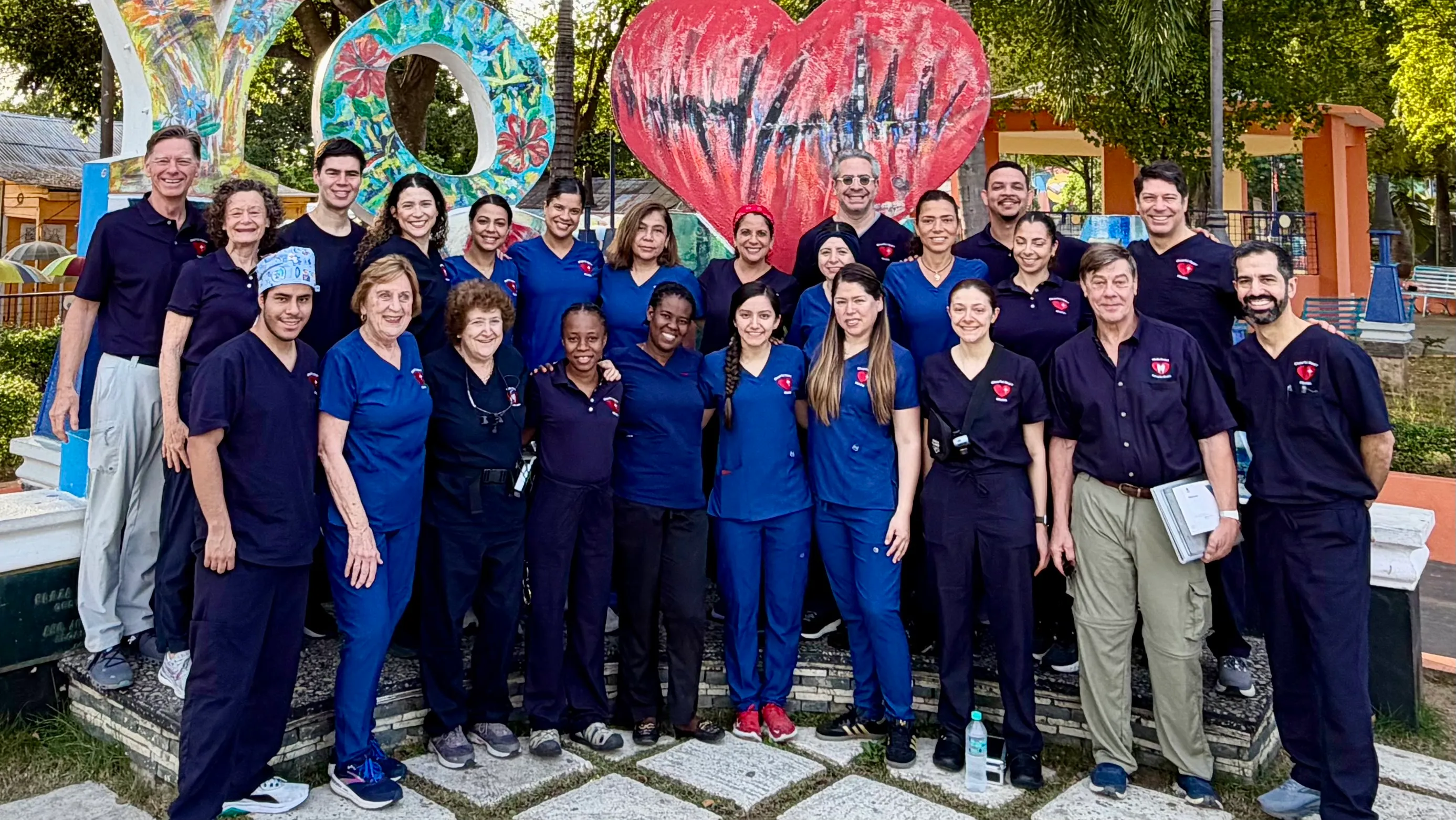 Cheerful Heart Mission volunteers and local team members gathered outside the clinic building