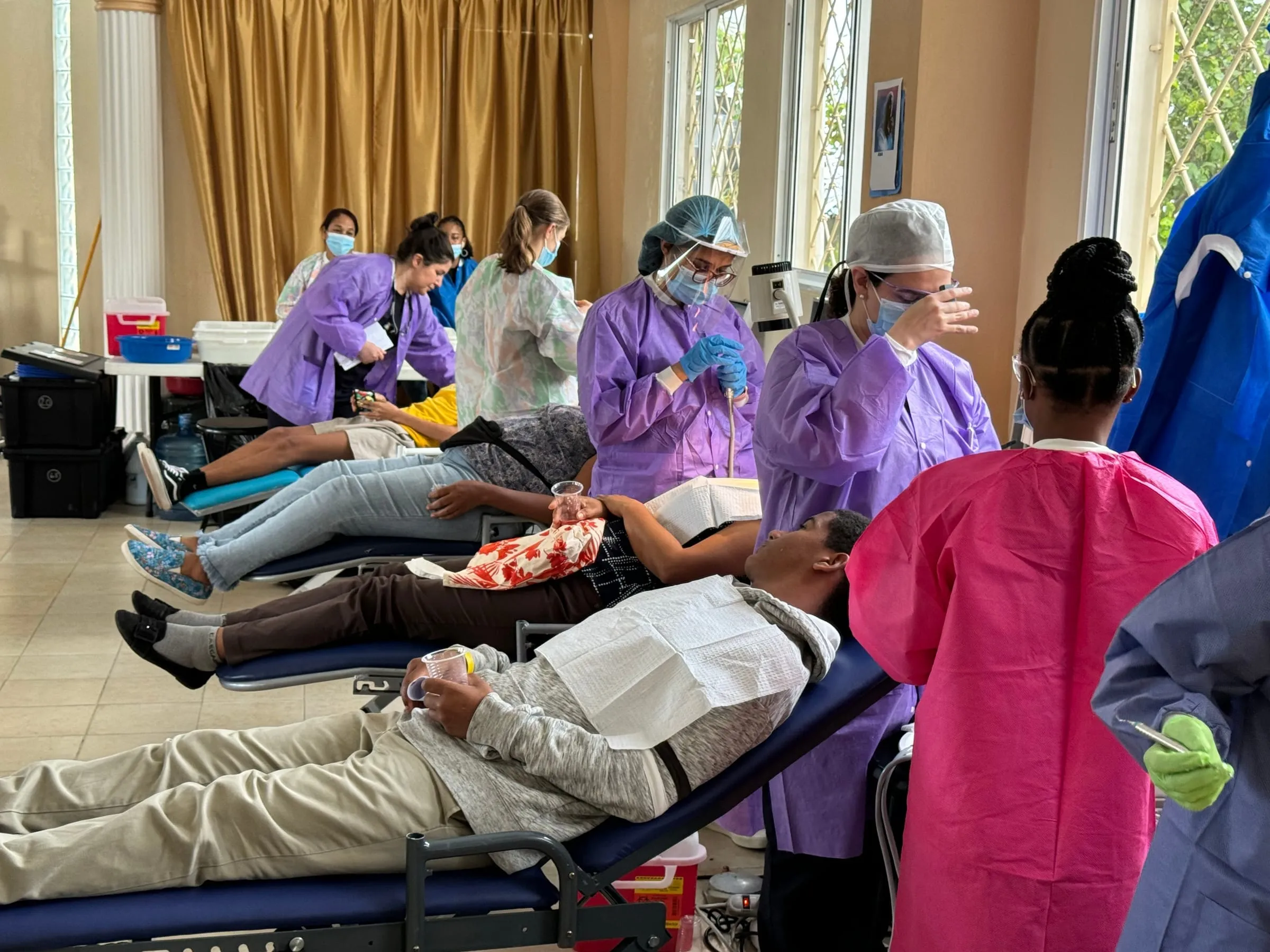Patients being treated in portable dental chairs