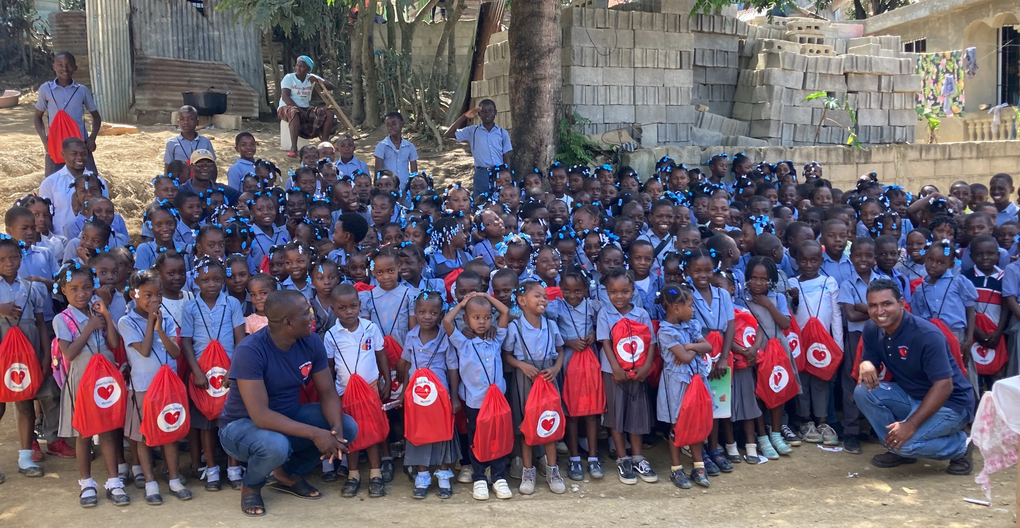 Students with their Operation Back to School backpacks in Tilori, Haiti