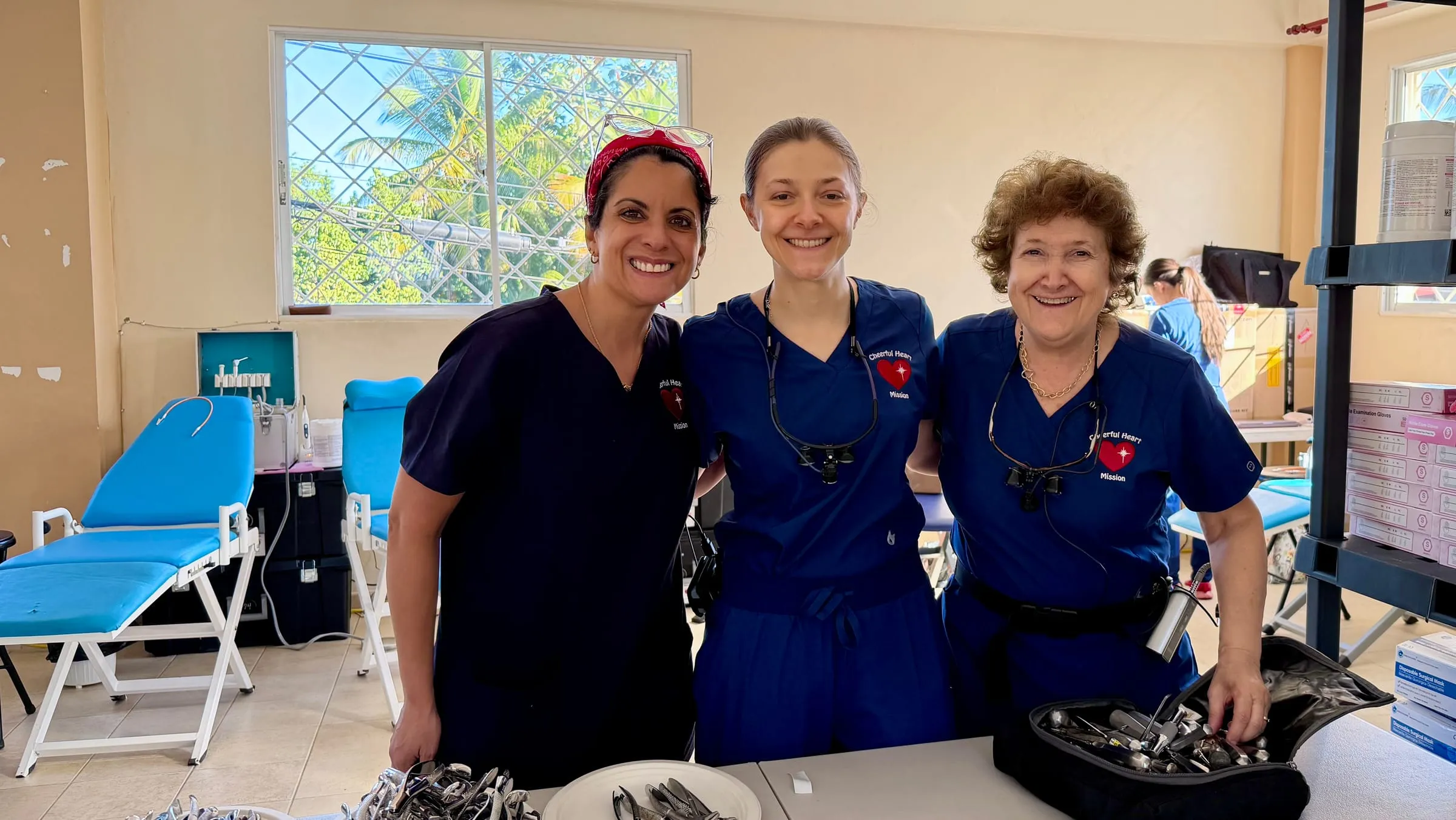 Dental volunteers prepare instruments before the clinic opens