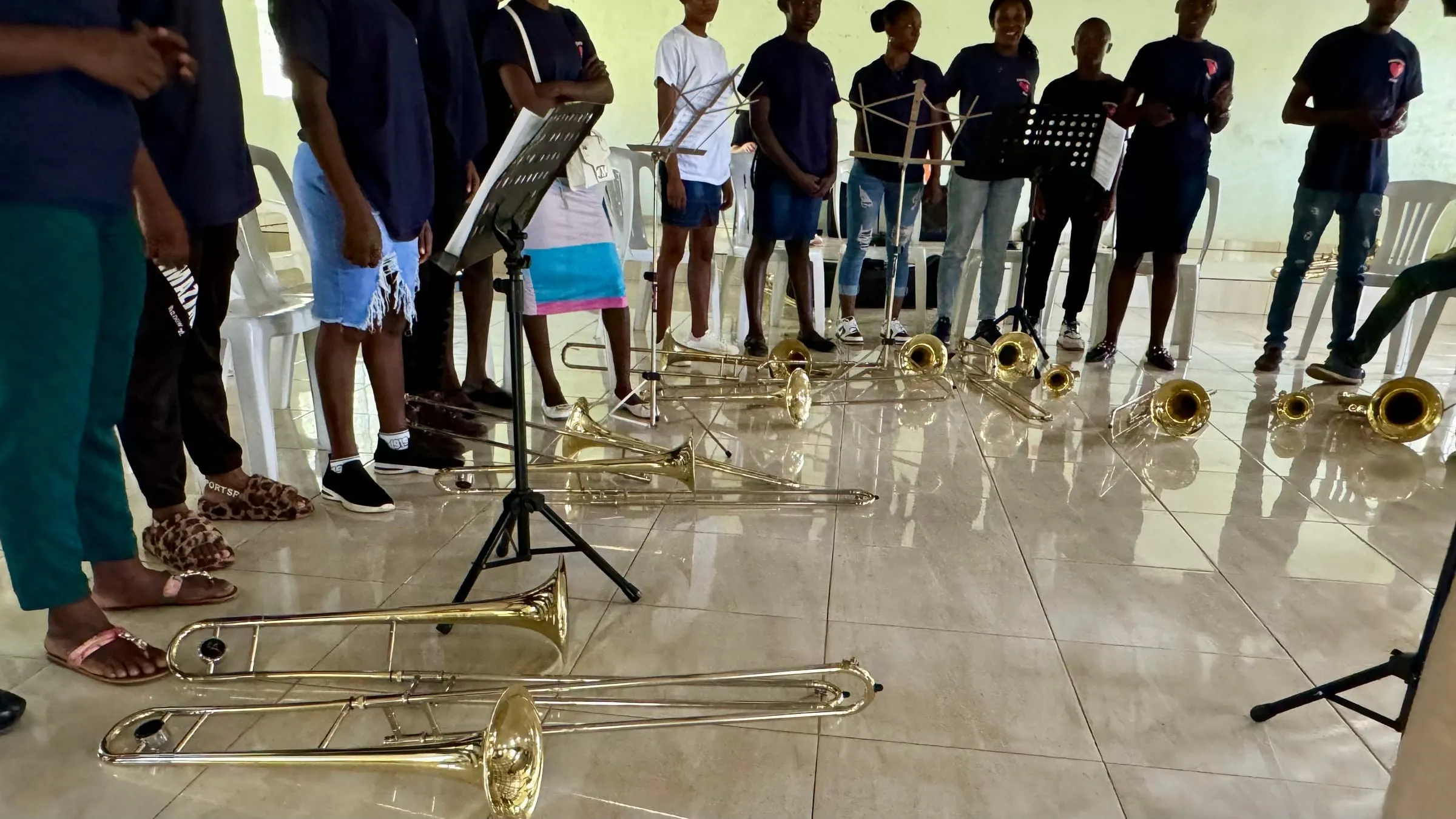 Trombones on the floor with students