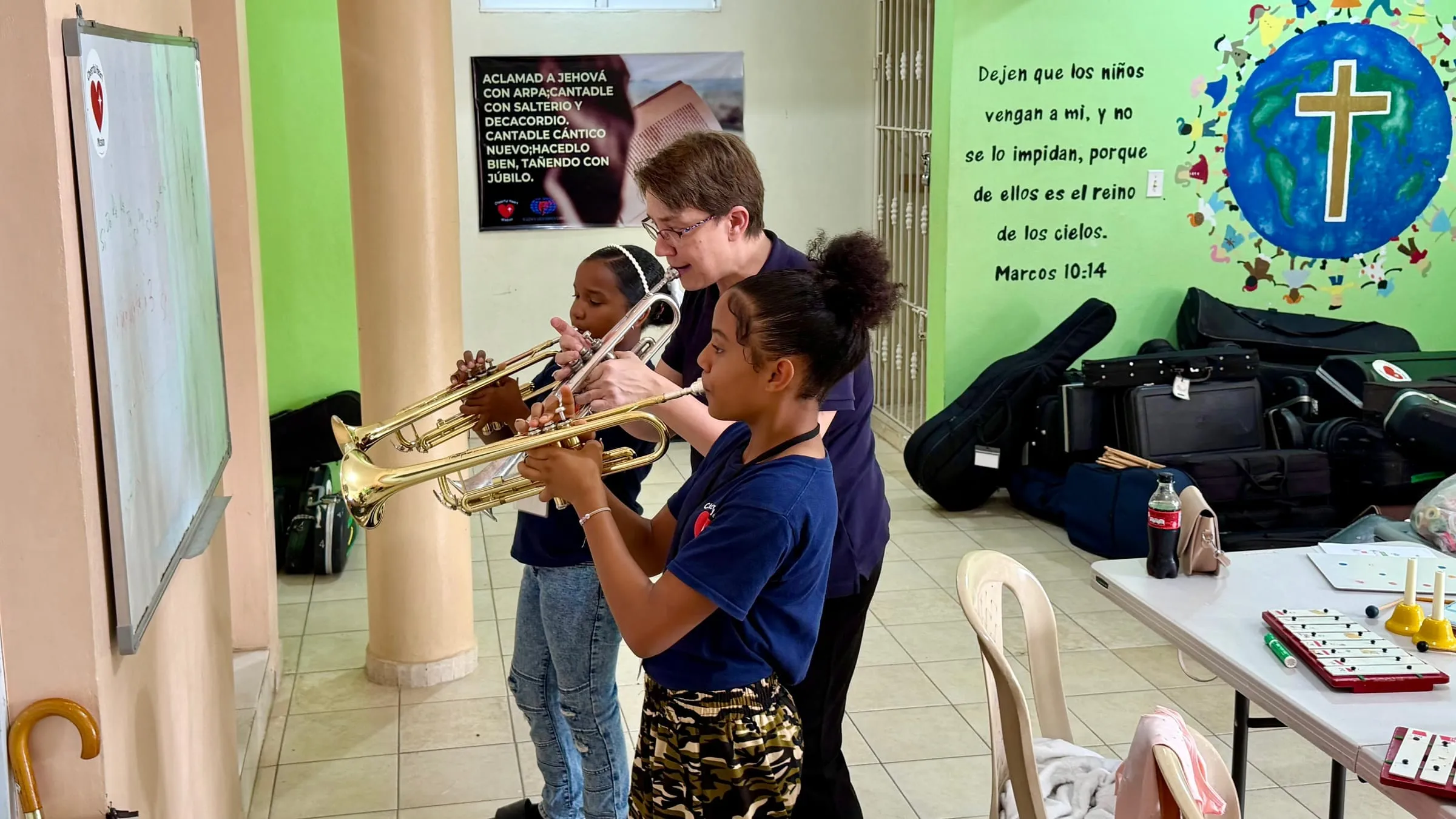 A trumpet lesson with two students
