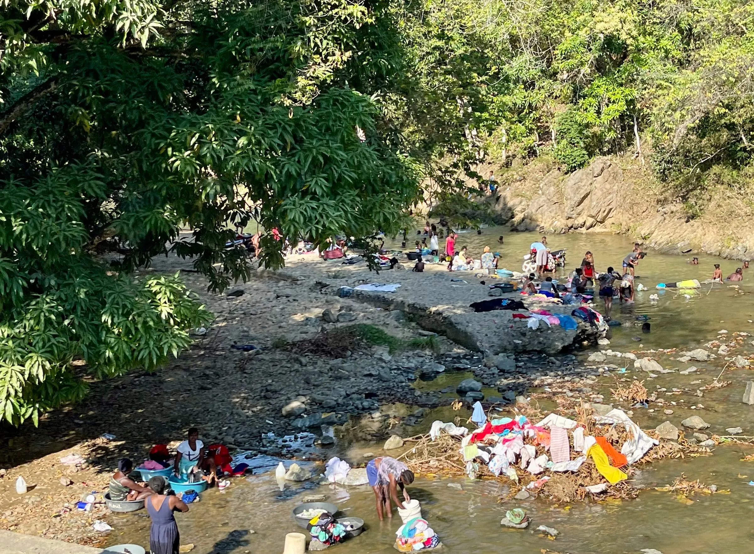 Villagers washing clothes in the river