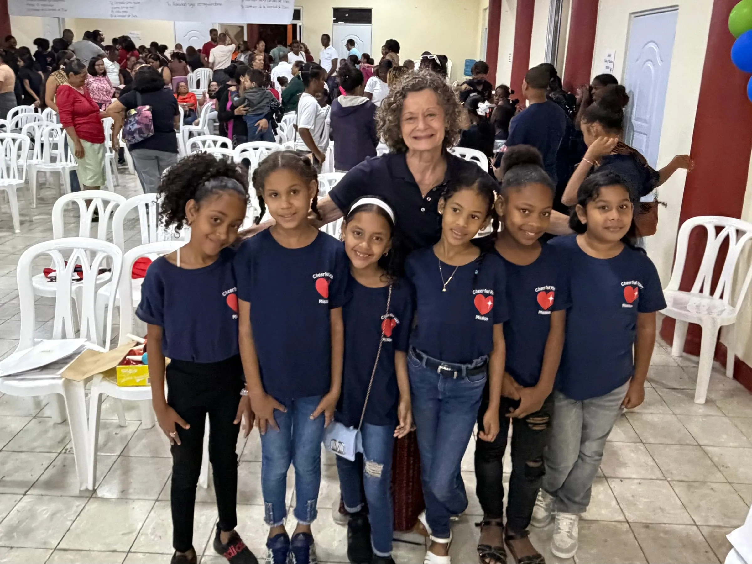 A volunteer with a group of girls